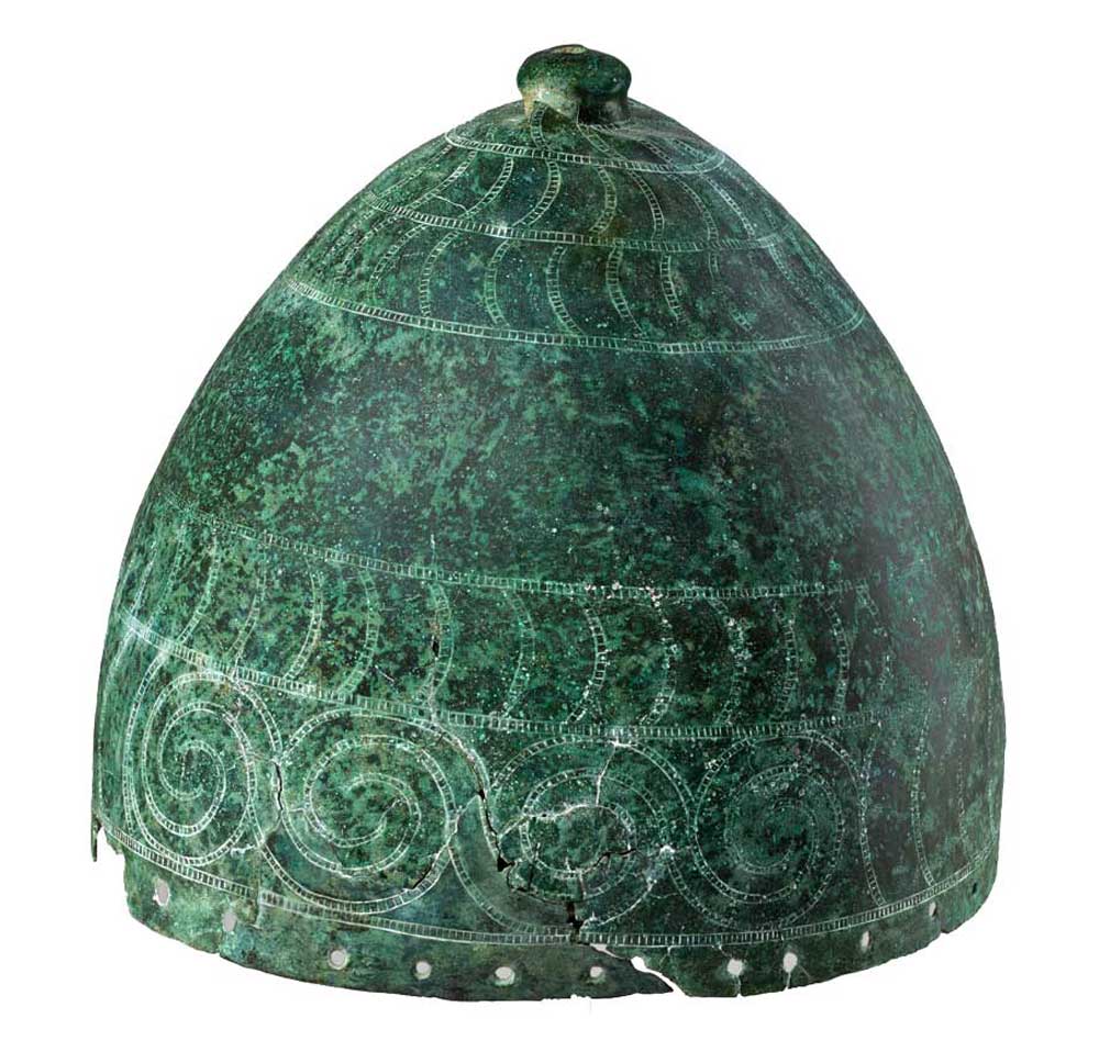 Bronze helmet decorated with punched bands of stylised boars' tusks and spirals