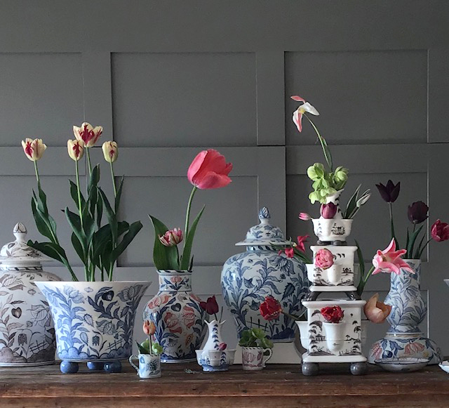 Isis Ceramics blue and white range by Deborah Sears on a table with colourful flowers