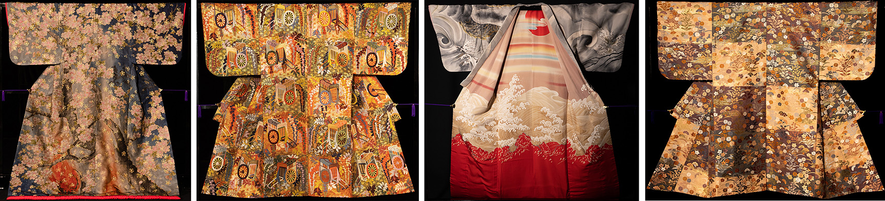 Four of the beautiful kimonos on display in the second rotation of Kabuki Kimono exhibition, with autumn leaves, circles, swirls and beautiful reds and oranges