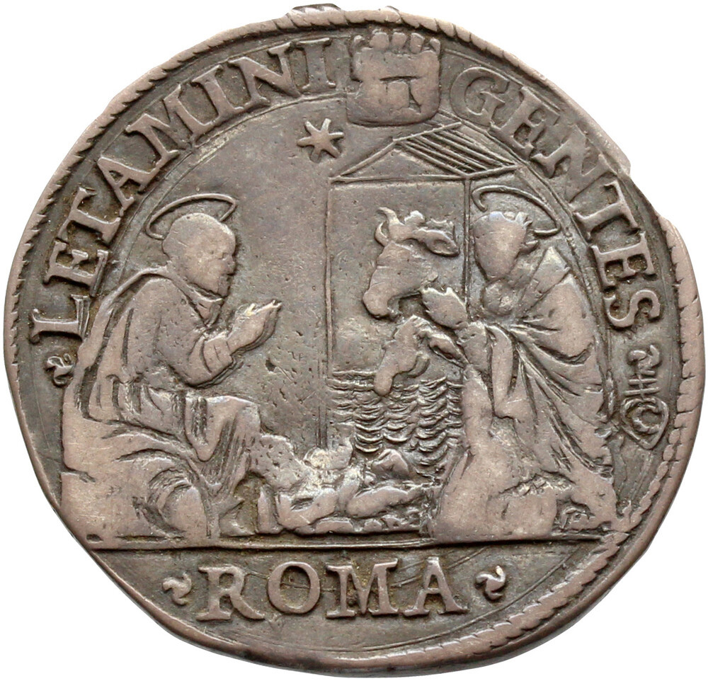 Reverse of a modern silver coin with a nativity scene 