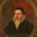 Painted portrait of John Dee who wears a black cap and a long white beard