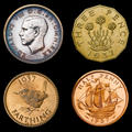 Different gold pattern designs for Edward VIII coinage  dating to1937 from the Royal Mint, showing the bust of Edward, a threepence piece, farthing and a half-penny