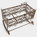 Antique rocking cradle in metalwork