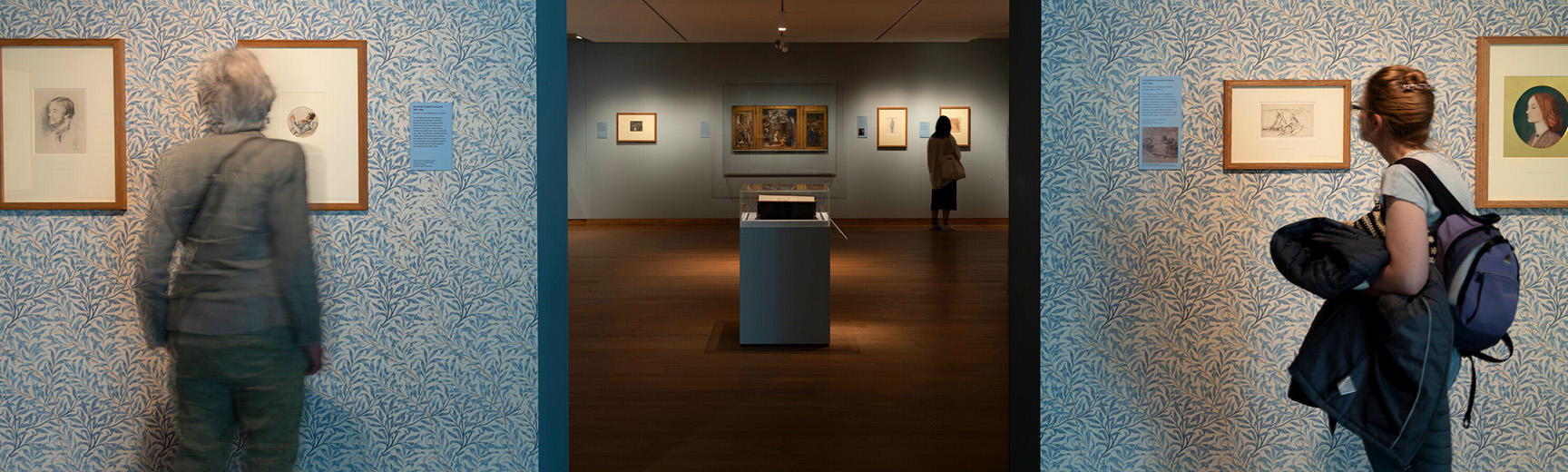 Visitors inside the Pre-Raphaelites exhibition of 2022