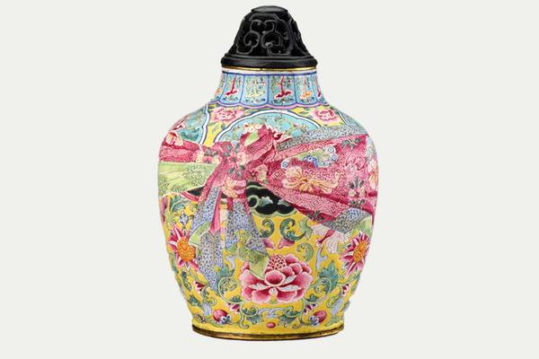 Small colourful lidded jar decorated in yellows, pinks and blues