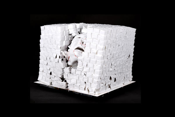 Untitled white porcelain sculpture by artist Fang Lijun, showing peeling bricks enclosing a head inside, 51cmx49cmx39cm, 2023