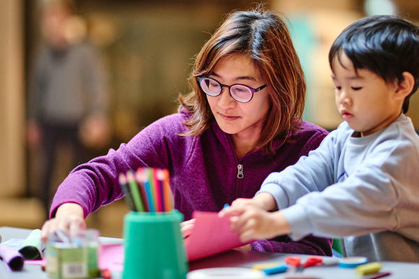 Mother and child doing craft activities at the family workshops