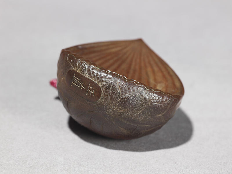 Detail of a Japanese Wooden Netsuke in the form of a Chestnut Detail of a Japanese Wooden Netsuke in the form of a Chestnut