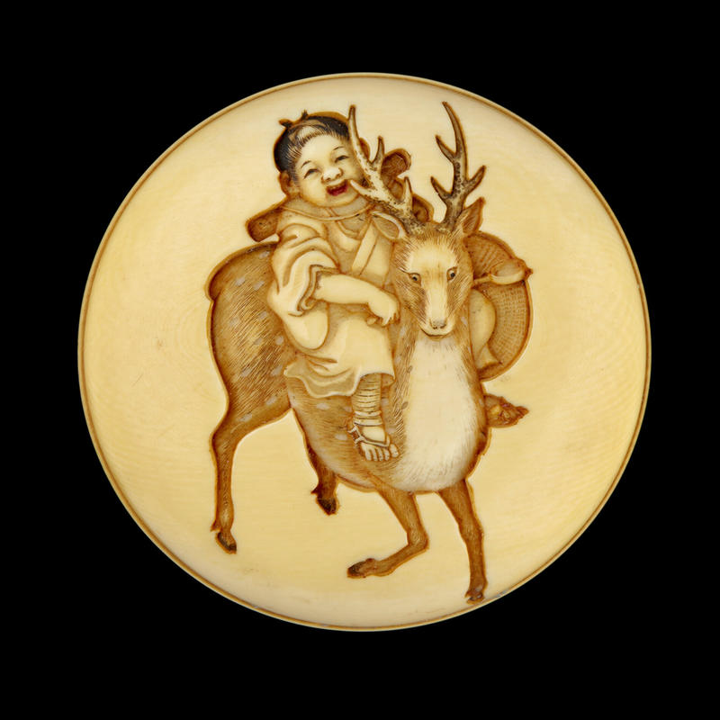 Manjū netsuke depicting a child riding a sacred deer, mid-late 19th century by Meikeisai Hōjitsu Manjū netsuke depicting a child riding a sacred deer, mid-late 19th century by Meikeisai Hōjitsu