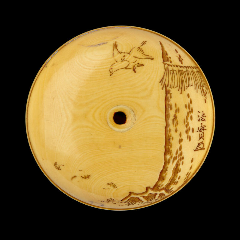 Reverse of a Manjū netsuke depicting a child riding a sacred deer, mid-late 19th century by Meikeisai Hōjitsu Reverse of a Manjū netsuke depicting a child riding a sacred deer, mid-late 19th century by Meikeisai Hōjitsu