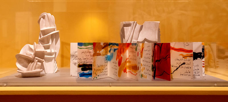 Orange and red sculptural book display in Dia al-Azzawi: Painting Poetry exhibition 