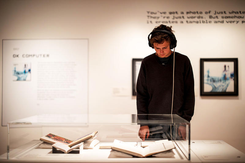 Visitor at one of the listening displays in the This is What You Get exhibition