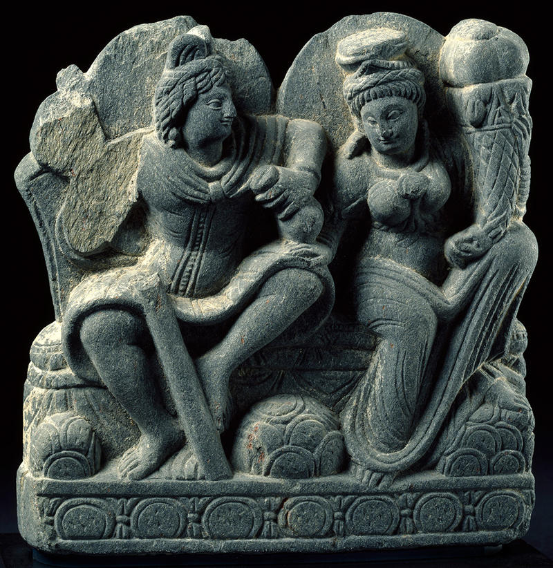 Small relief sculpture depicting Buddhist deities Hariti and Panchika, who holds a purse and staff, 3rd to 4th century