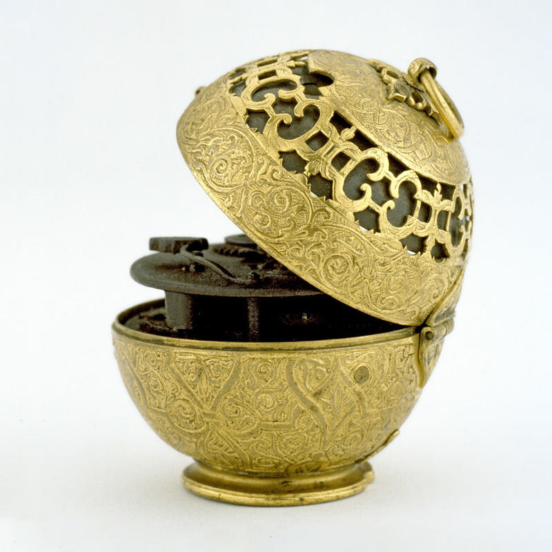 Golden spherical cased verge clock-watch WA1947.191.1 An ornate golden, metallic, spherical ball with a clock face on the front