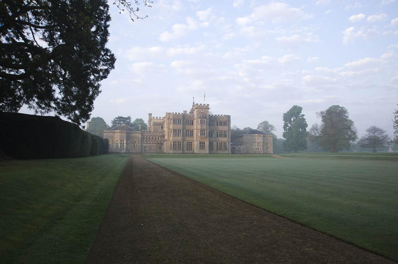 View of Rousham House exterior from the driveway on a foggy morning