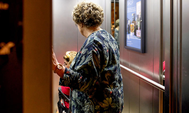 Visitors using the lift at the Museum