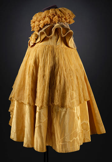 Shimmering and frilly yellow moire and chiffon cape with yellow satin lining c. 1898