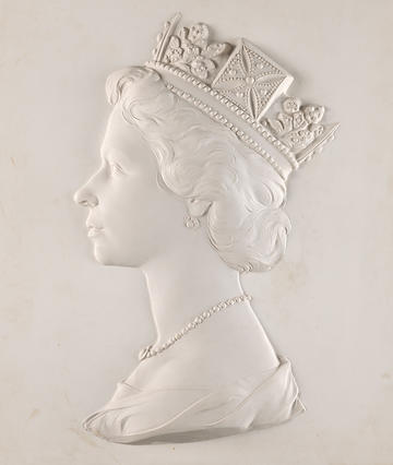 A white plaster relief 'dressed head' bust of Queen Elizabeth II - used on billions of postage stamps