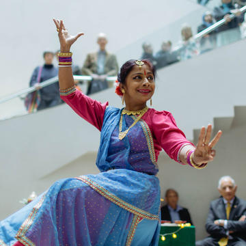 A woman dancing in the atrium