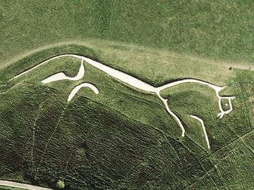 Uffington White Horse aerial view in chalk carved into the hillside