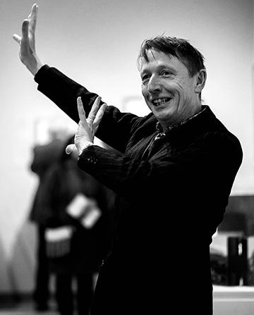 Director Xa Sturgis Director Xa Sturgis gesticulating at an Ashmolean event in black and white
