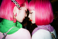 Photograph by Ninagawa Mika of two pink-haired young women facing each other