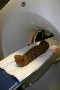 Egyptian child mummy (died between AD 80 - 120) entering CT scanner Egyptian child mummy (died between AD 80 - 120) entering CT scanner